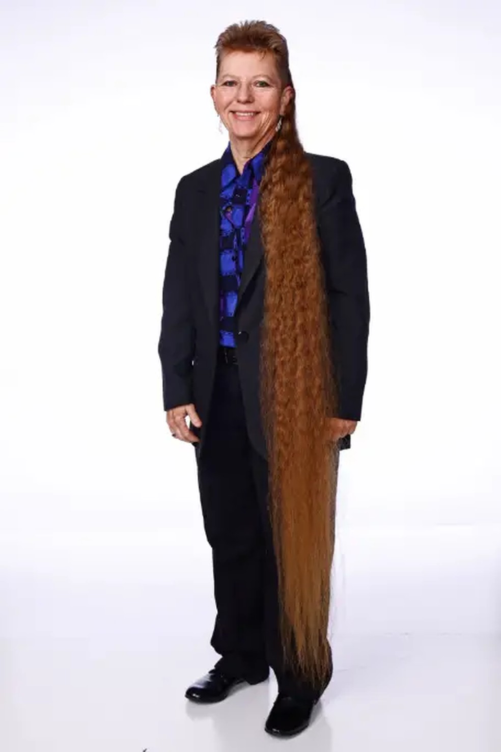 Mulher do Tennessee bate recorde de cabelo mullet mais longo do mundo — Foto: Divulgação